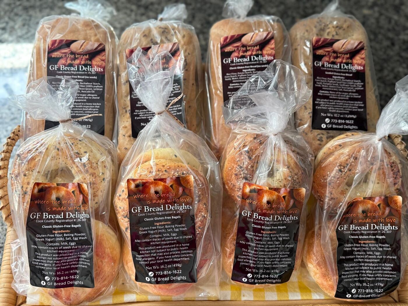 Packaged loaves and bagel four-packs with GF Bread Delights labels